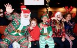 Santa Claus and his elves celebrate Christmas at the Lemoore Christmas Parade.